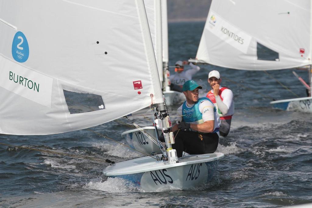 2016 Gold Medalist, Tom Burton (AUS) crosses the finish line of the Mens Laser, with Sam Meech (NZL) astern © Richard Gladwell www.photosport.co.nz